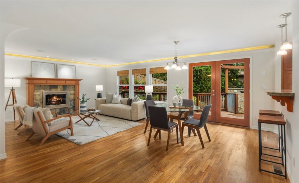 Living room staged around a brick fireplace in a classic Bellevue family home
