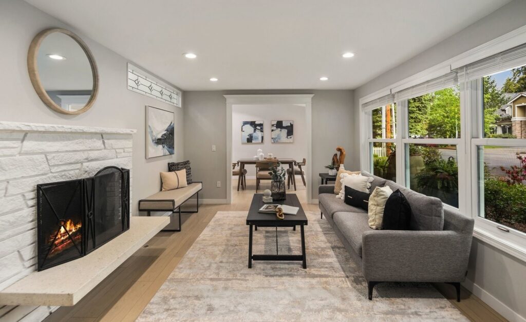Kirkland home staging in a refreshed family home living room with a white brick fireplace